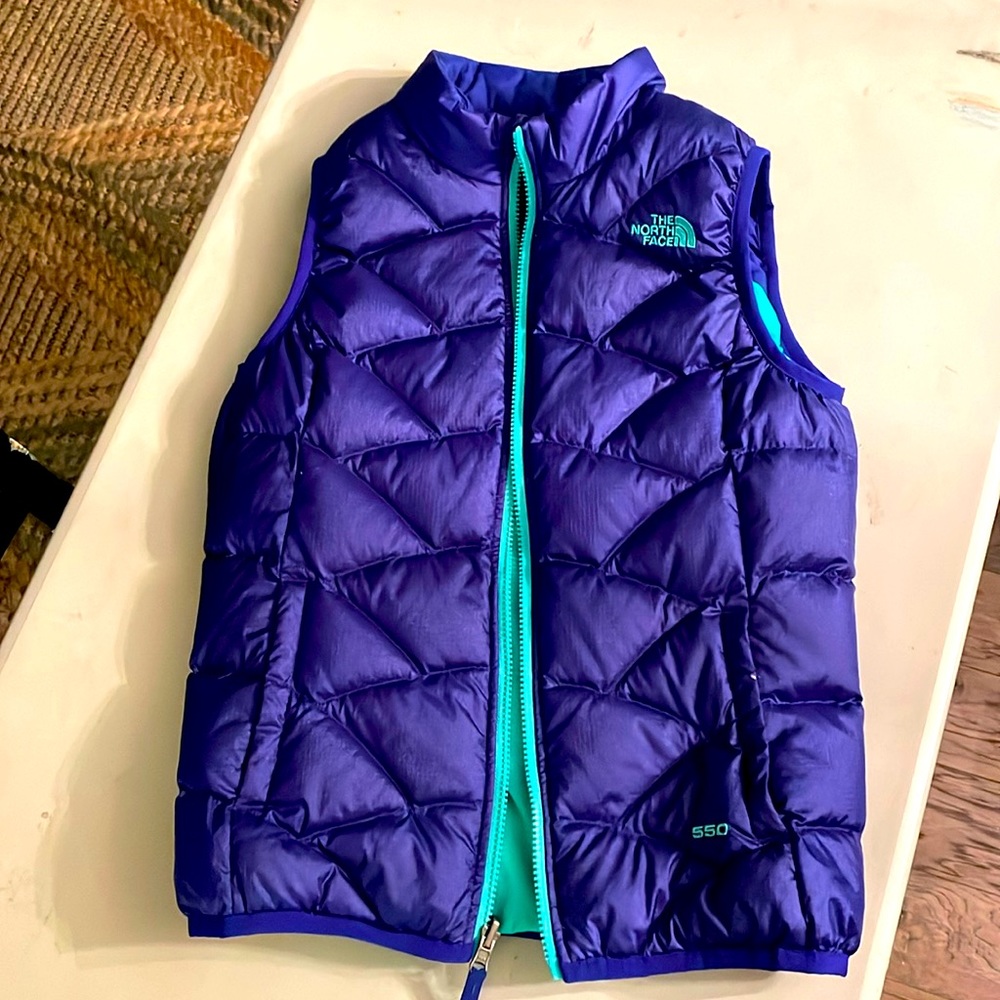 North Face Women’s 550 Reversible down vest, dark purple reverses to mint green.